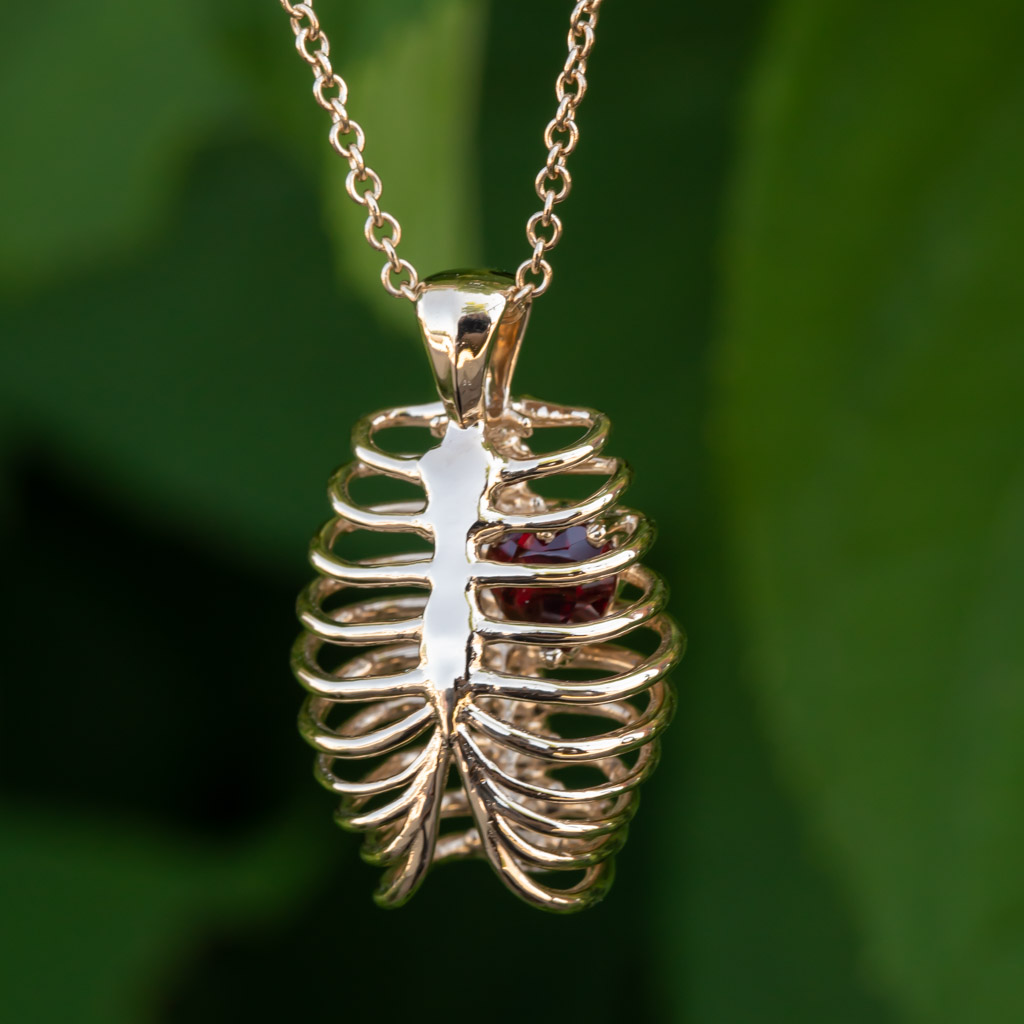 Heart-shaped Ruby in a Yellow Gold Ribcage Pendant
