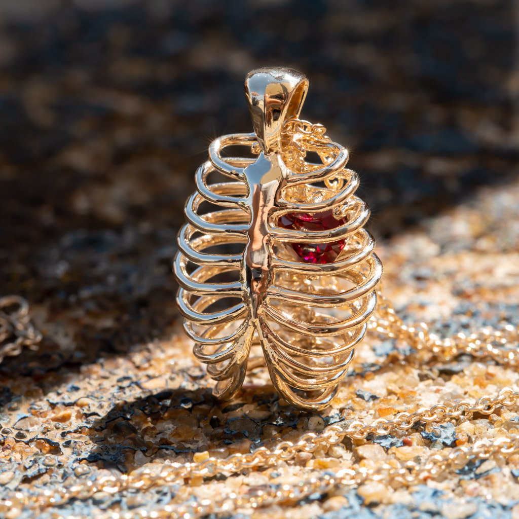 Heart-shaped Ruby in a Yellow Gold Ribcage Pendant